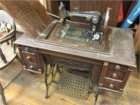Vintage W-K sewing machine with attachments.  28”