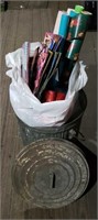 Metal trash can w/wrapping paper and gift bags