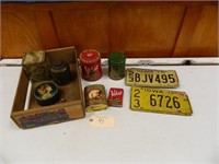 Antique Tins and License Plates in fruit box