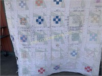 Antique well loved block pattern quilt