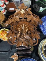 Wood carved cuckoo clock.