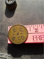 C C C COMPANY 1 STICK OF POWDER BRASS TOKEN