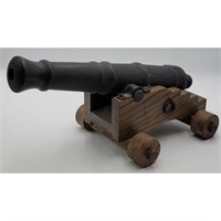 A Large Cannon On Wood Stand