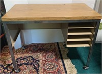 Child’s rolling metal desk w/compartments. 33” W
