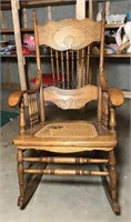 Wooden rocking chair with carved backing *torn