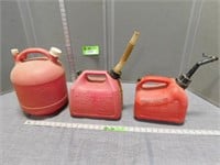 3 Plastic gas cans; 1 gallon, 1 1/2 gallon and 2 1