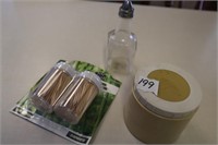 toothpicks, vinegar bottle, container