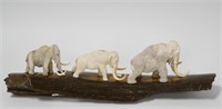 Moose antler carving of mammoths with ivory tusks