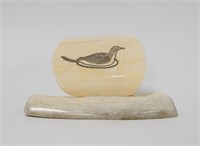 Ivory scrimshaw of a bird