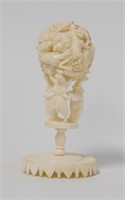 Ball ivory carving with ivory base