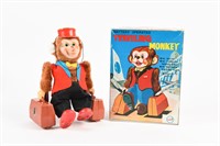 TRAVELLING MONKEY BATTERY OPERATED TOY / BOX/ NOS