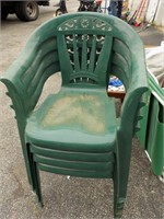 4 green plastic chairs