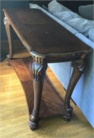Dark wood sofa table, with carved legs, double