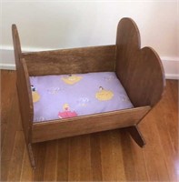 Wooden doll cradle,