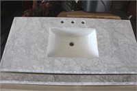 Marble bathroom sink with back splash.48 x 22