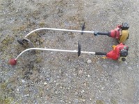 2 homelite grass trimmers - both stored in shed,