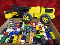 Diecast cars and plastic loader toys.