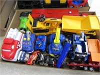 Plastic toys, dump trucks, Percy train.