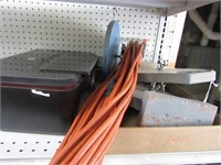 Printer, extension cord, saw blade holders.