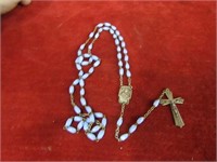 Blue bead rosary.