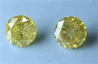 1.31 cts Yellow Round Brilliant (2) Diamonds SI1