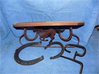 Horse shoe shelf