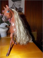 plastic horse with saddle