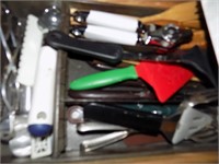 drawer with kitchen utinsels and can opener
