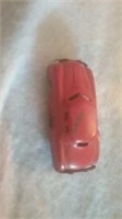 Small red metal tin car