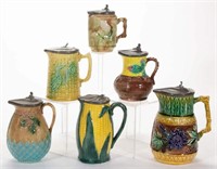 Collection of ceramic syrup pitchers