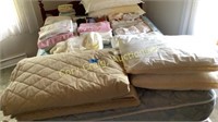 All linens on bed, quilt, blankets, sheets etc.