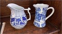 2 blue & white pitchers