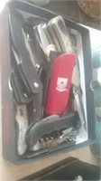 Box of pocket knives including a Red Cross knife