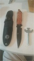 Hunting style knife with Black Blade and a s