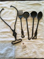 Group of cast iron cooking utensils