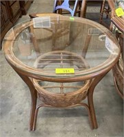GLASS TOP OVAL END RATTAN TABLE