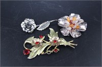 Three sterling floral broaches