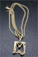 14kt necklace with 14kt and diamond M pendant