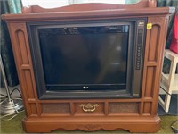 LG TV on wooden console