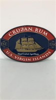 Cruzan rum oval tin sign.  23x15