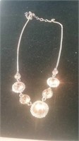 Gold tone necklace with pink stones and