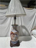 Oriental table lamp with wooden base