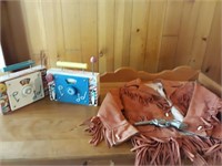 Suede children's cowboy coat and toy pistol with
