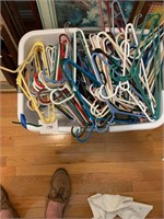 CLOTHES BASKET FULL OF HANGERS