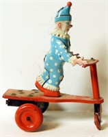 Lot #1364 - Vintage tin wind-up clown on scooter