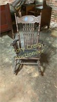 Antique press back rocker with leather bottom