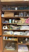Contents of cabinet, linens old jars, glass wear