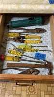 Tools in drawer in cabinet marked 222
