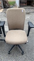 2 Tan office chairs on rollers