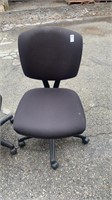2 black office chairs on rollers